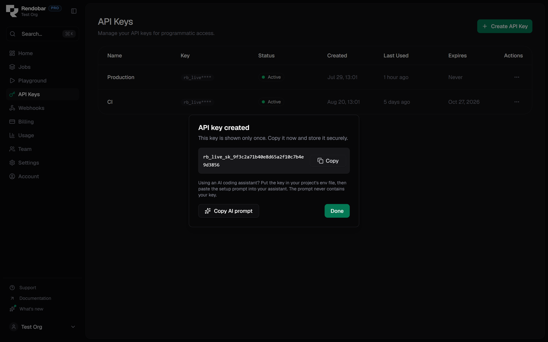 The API key created dialog in the Rendobar dashboard, showing the key once with a Copy button, a note about putting it in an env file, and a Copy AI prompt button beside Done.